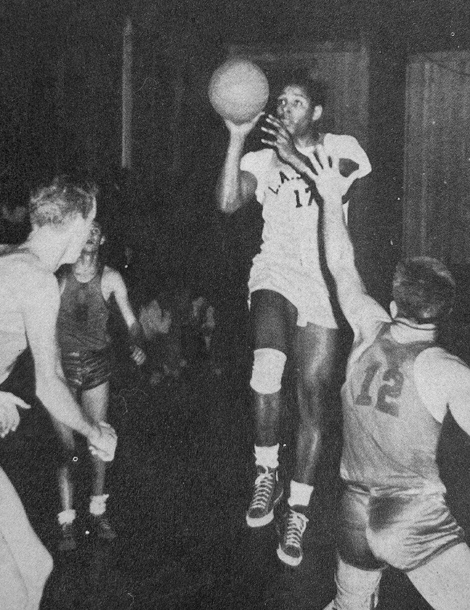 An action photo of Ed Sparrow shooting the basketball.