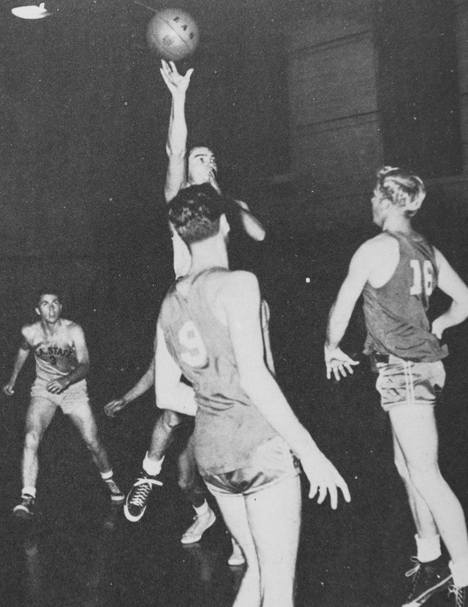 An action photo of Wayne Scott shooting the basketball.