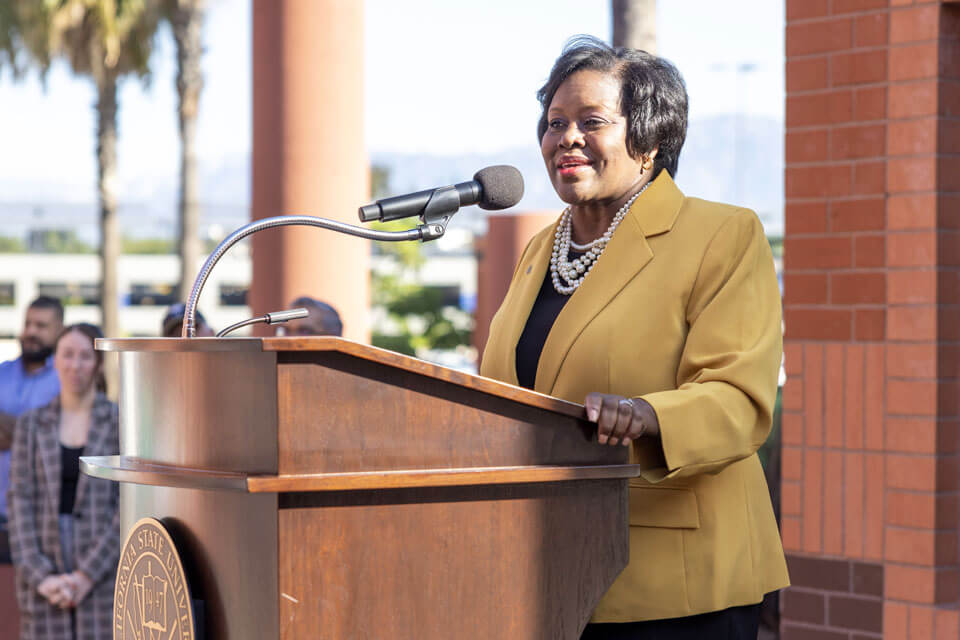 President Eanges speaks from a podium during her first visit to Cal State LA.