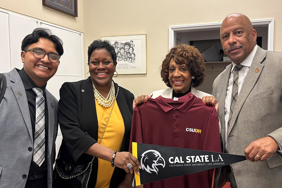 President Eanes and the Cal State LA team with Representative Maxine Waters.